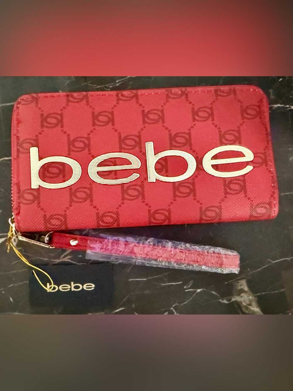 bebe Red Logo Wristlet with Gold Accents